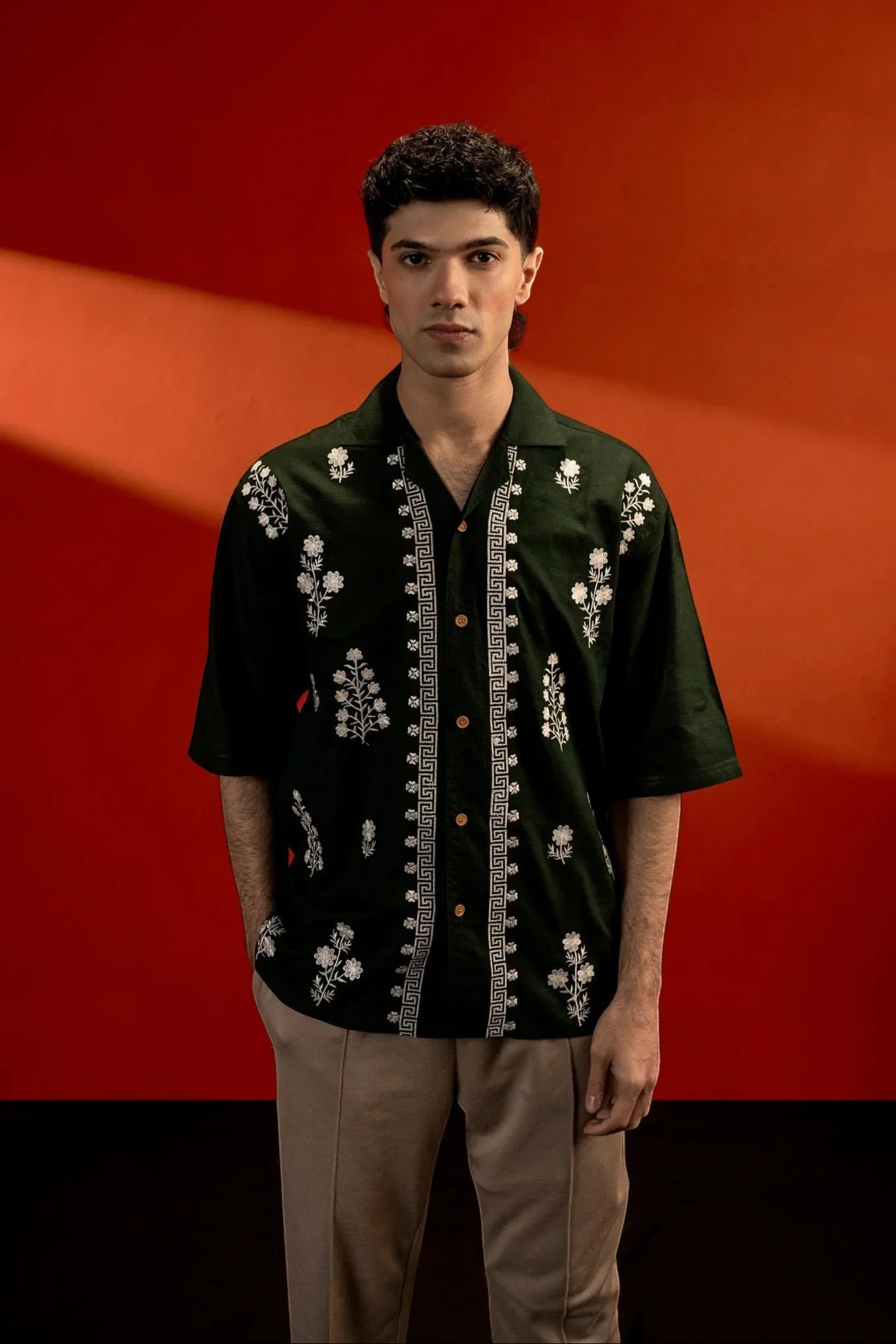 Koti Apparels unisex dark green cotton jacquard shirt with white floral embroidery and quarter sleeves.