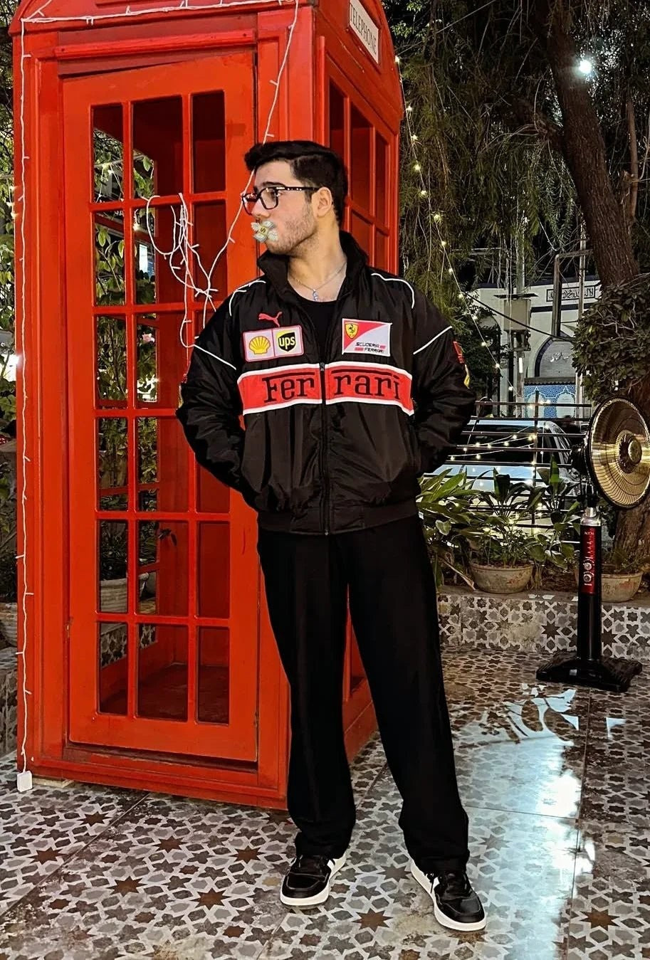 Koti Apparels black polyester Formula 1 Ferrari racing jacket with red and white accents and embroidered logos.