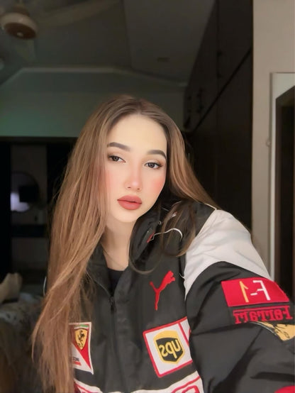 Koti Apparels black, red, and white Formula 1 Ferrari racing jacket with embroidered logos and a woman wearing it.