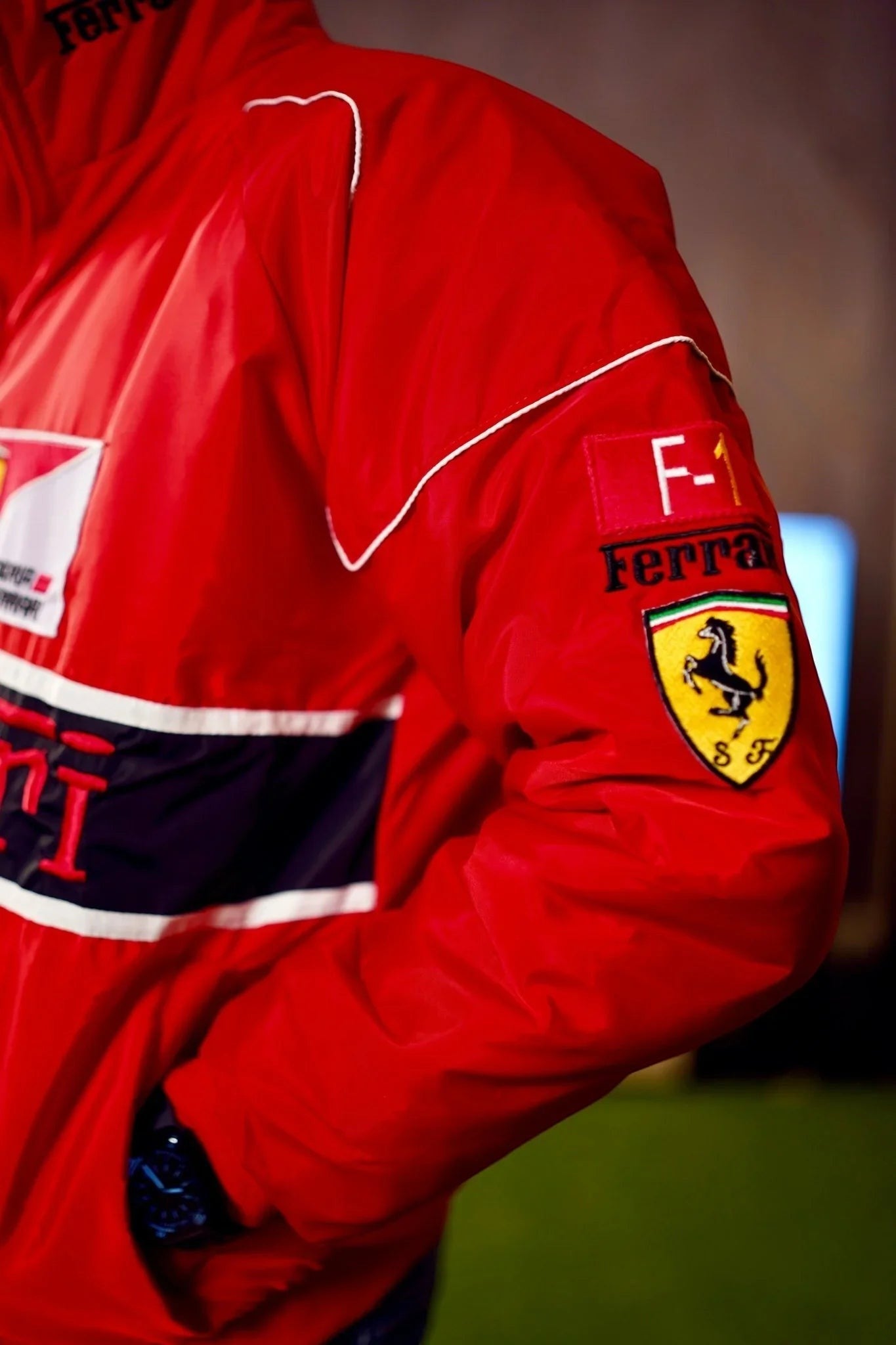 Koti Apparels red F1 Ferrari bomber jacket with embroidered logos and white piping. Unisex streetwear style.