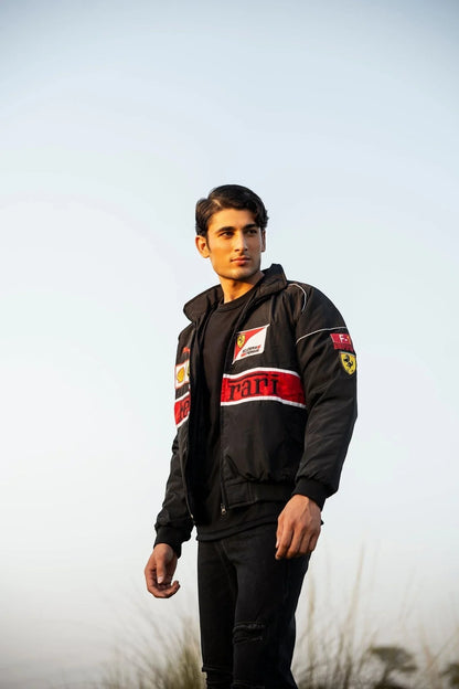 Koti Apparels black F1 Ferrari racing jacket with red and white accents, featuring embroidered logos and a windbreaker material.