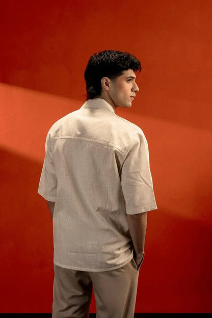 Koti Apparels beige 100% cotton jacquard shirt with half sleeves and textured finish, worn by a man.