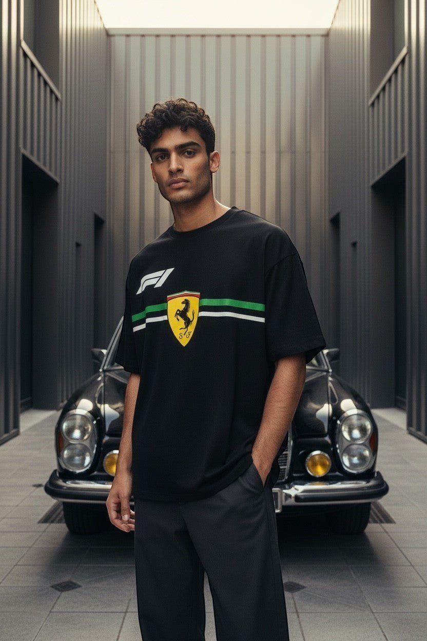 Koti Apparels black cotton Formula 1 t-shirt with Ferrari Prancing Horse logo and green/white stripe detail.