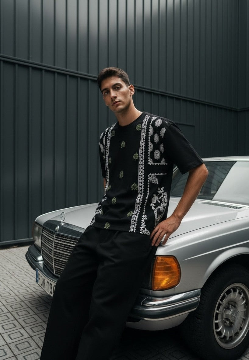 Koti Apparels black cotton blend t-shirt with bandana and floral graphic print on back, relaxed fit.