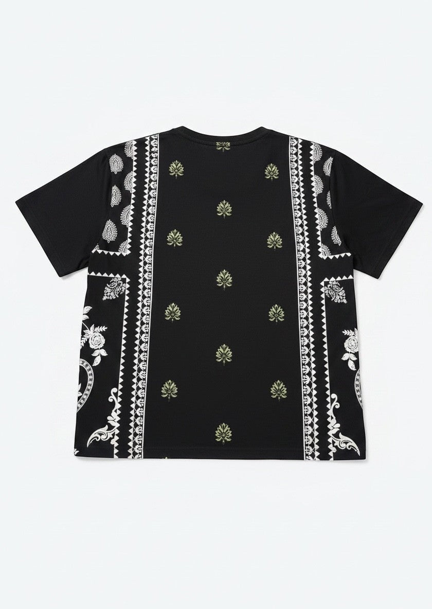 Koti Apparels black cotton blend t-shirt with graphic print featuring paisley and floral motifs in green and white.
