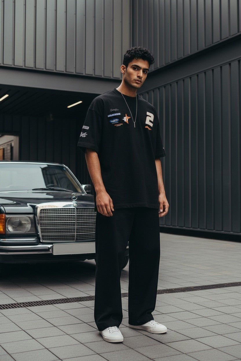 Koti Apparels black oversized cotton t-shirt with graphic print, racing patches, and number 2.
