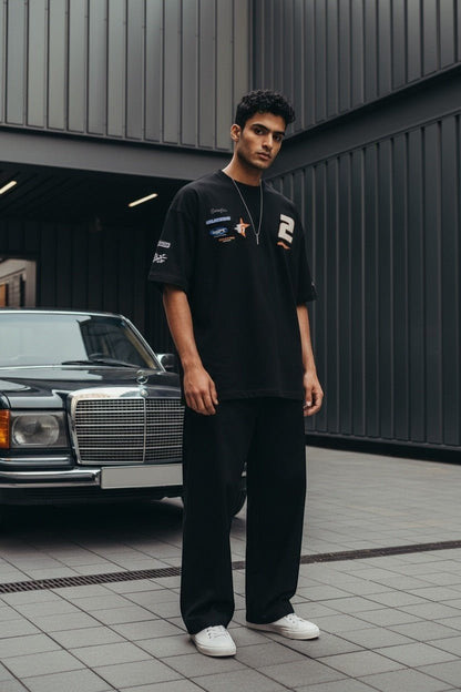Koti Apparels black oversized cotton t-shirt with graphic print, racing patches, and number 2.