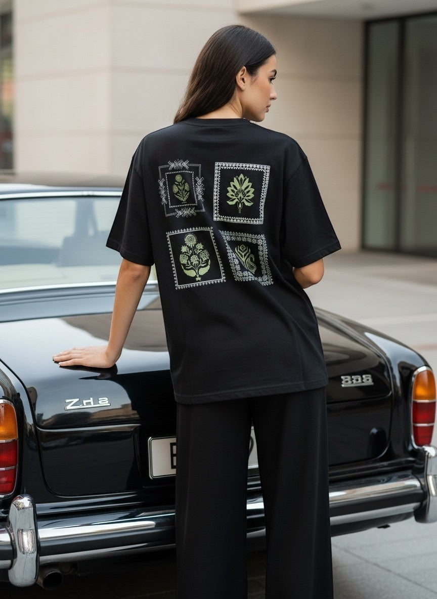 Koti Apparels black cotton blend t-shirt with graphic print of four botanical squares on back. Relaxed fit.