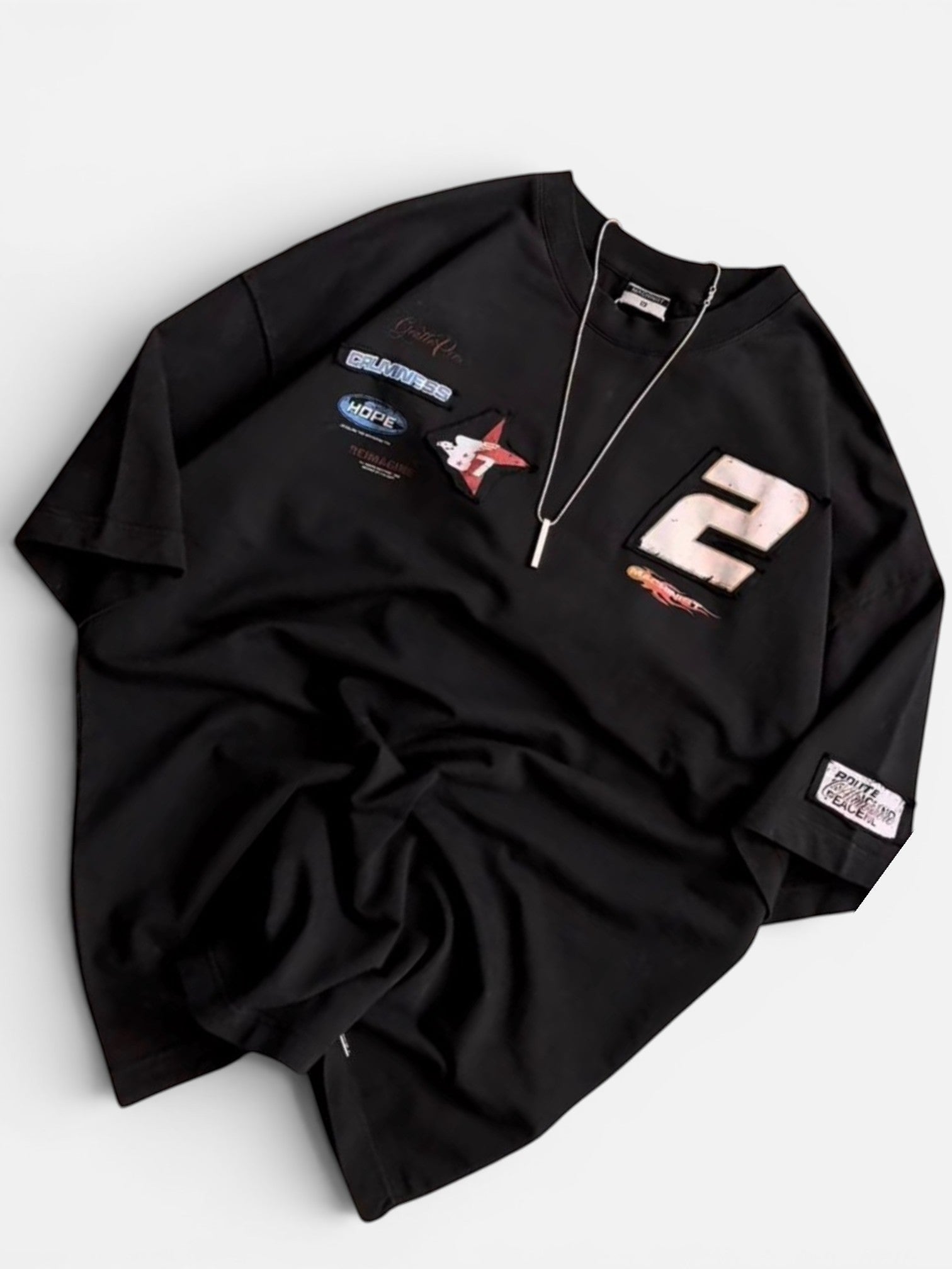 Koti Apparels black oversized long sleeve cotton t-shirt with graphic patches and number 2.