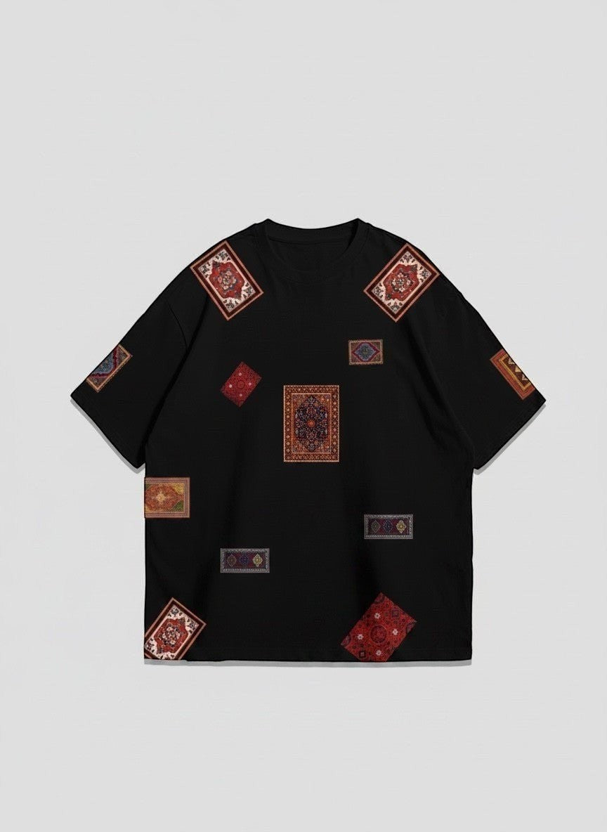 Koti Apparels black cotton t-shirt with a collage of colorful, vintage oriental rug patches. Relaxed fit, crew neck.