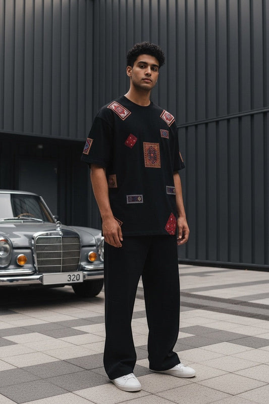 Koti Apparels black cotton t-shirt with eclectic vintage oriental rug patches, relaxed fit, short sleeves.