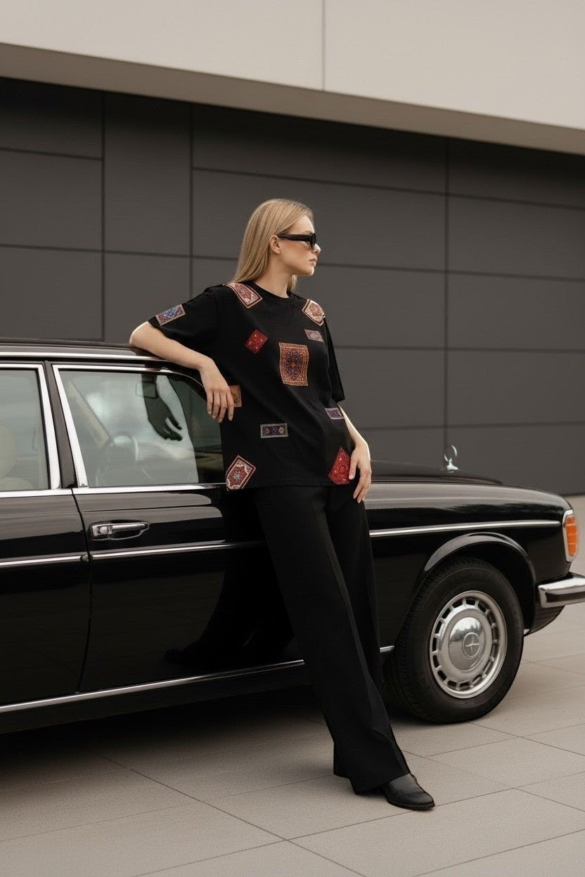 Koti Apparels black cotton t-shirt with colorful oriental rug patches, relaxed fit, short sleeves.