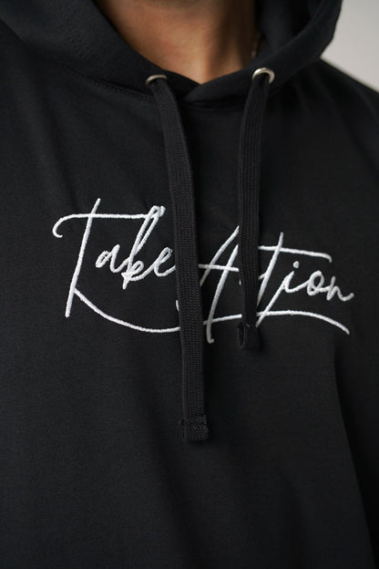 Koti Apparels black heavyweight cotton unisex hoodie with embroidered "TAKE ACTION" text on the front.