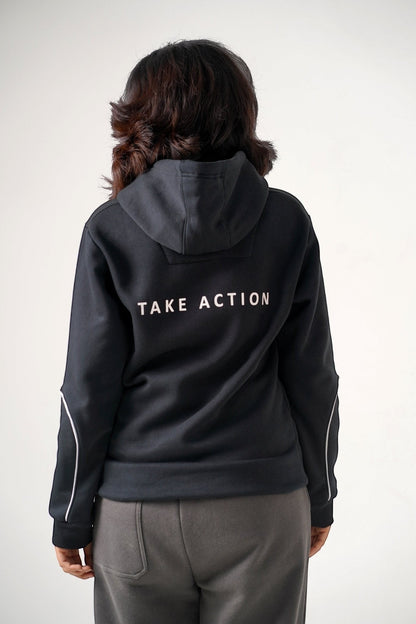 Koti Apparels black heavyweight cotton fleece unisex hoodie with "TAKE ACTION" text on back and matching grey trousers.