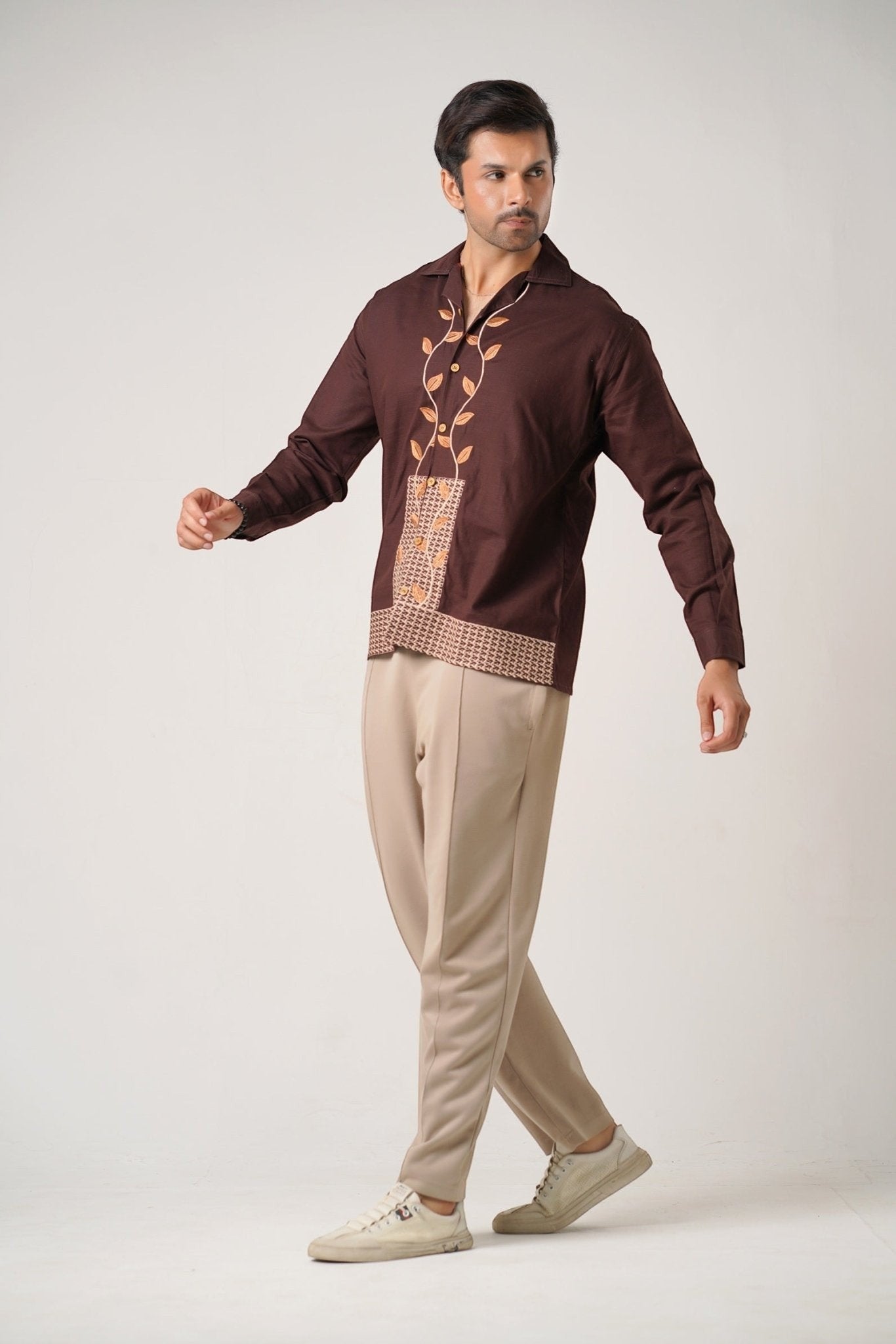 Koti Apparels unisex brown khaddar shirt with leaf embroidery on front, open collar, and beige geometric panel.