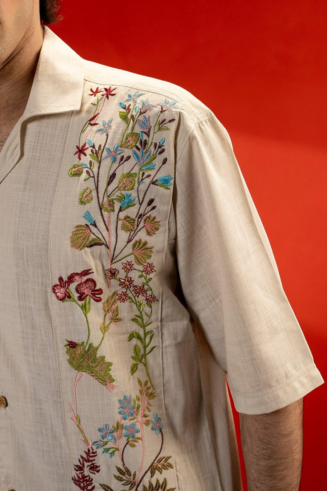 Koti Apparels beige 100% cotton jacquard shirt with floral embroidery on the shoulder and half sleeves. Unisex relaxed fit.