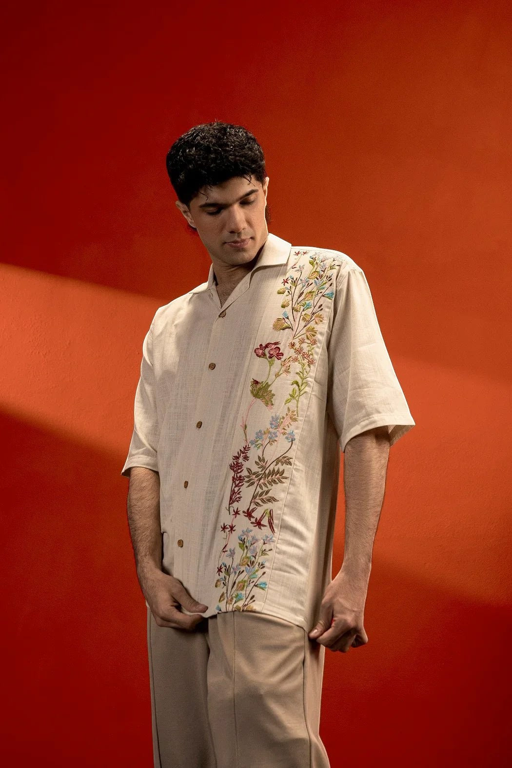 Koti Apparels beige 100% cotton jacquard shirt with floral embroidery and half sleeves, worn by a man.