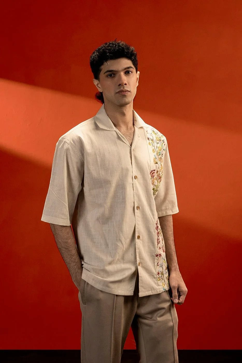 Koti Apparels unisex beige 100% cotton jacquard shirt with embroidered floral detail on the side and half sleeves.