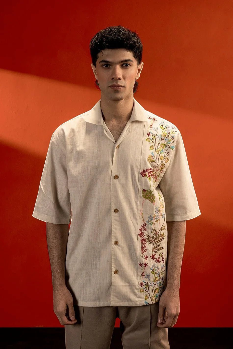 Koti Apparels beige 100% cotton jacquard shirt with embroidered floral detail on the left side, half sleeves, and button-down front.