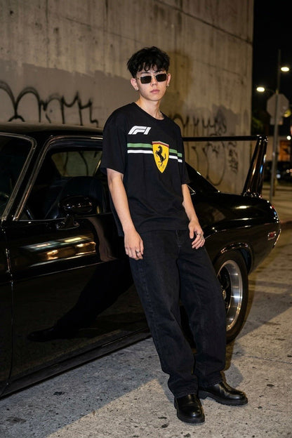 Koti Apparels black cotton t-shirt with Formula 1 Ferrari logo and green/white stripe detail.