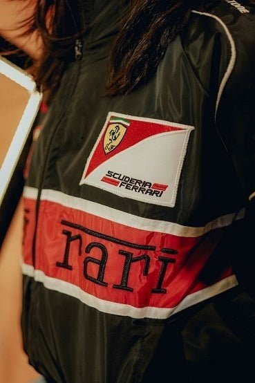 Koti Apparels black parachute F1 Ferrari jacket with red and white stripe and embroidered logos.