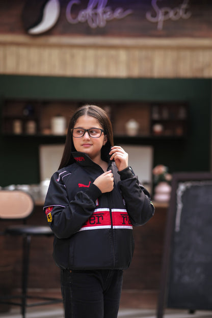 Koti Apparels black Ferrari racing jacket with red and white chest stripes worn by a girl in a cafe setting