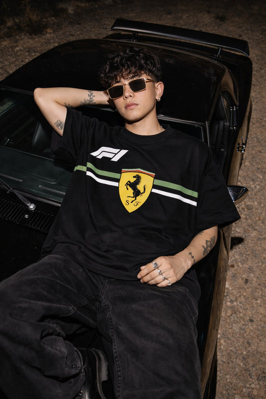 Koti Apparels black Formula 1 Ferrari t-shirt with Prancing Horse logo, F1 branding, and green/white stripe detail.