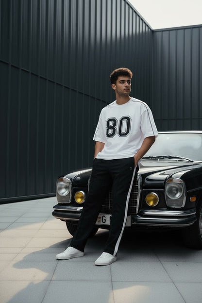 Koti Apparels white cotton blend t-shirt with black "80" graphic and black piping detail.