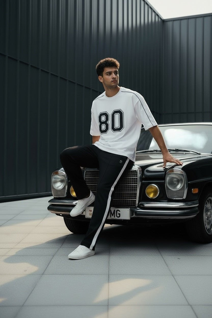 Koti Apparels white cotton blend t-shirt with black "80" graphic and black piping detail.