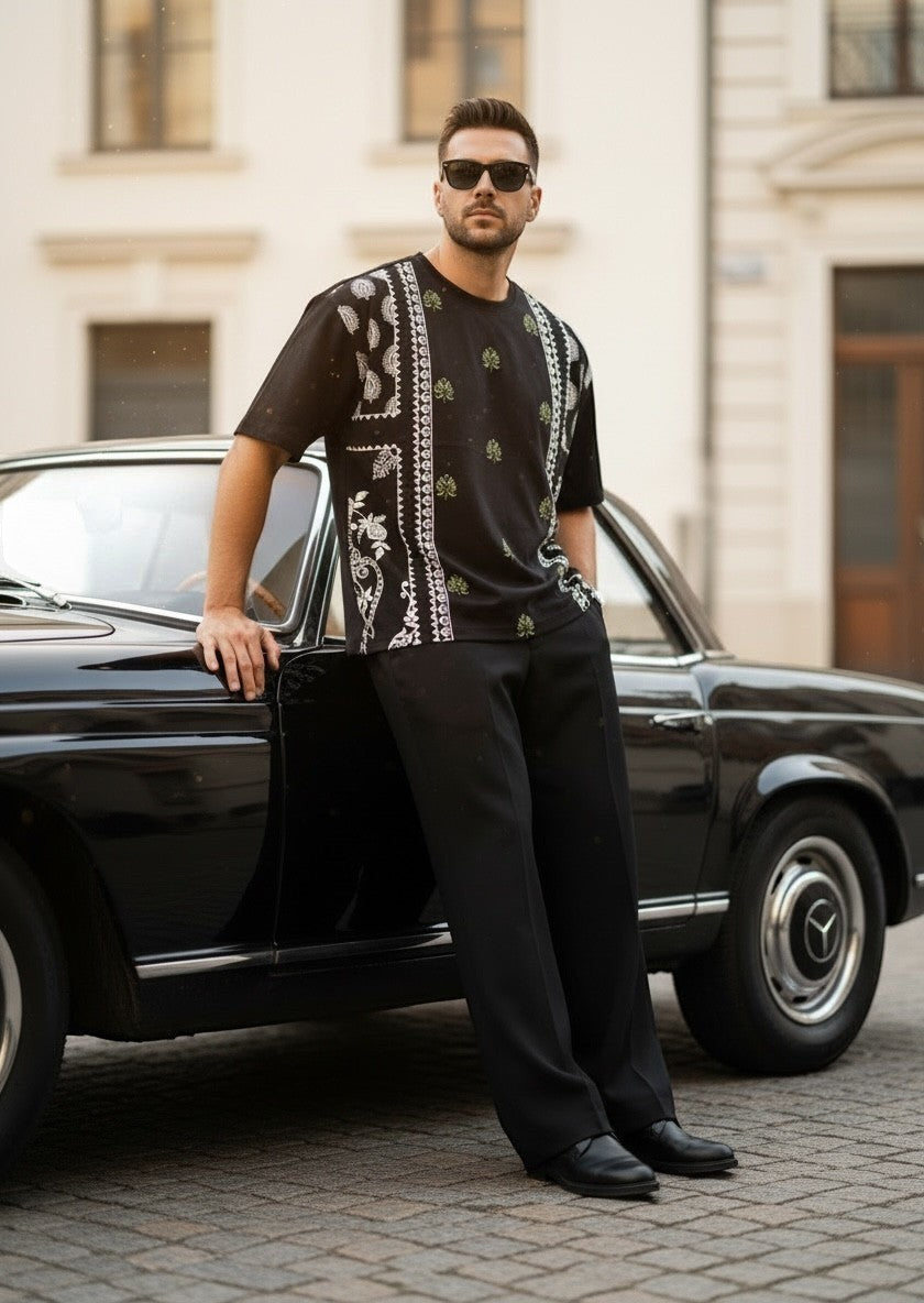 Koti Apparels black cotton blend t-shirt with bandana and floral graphic print, relaxed fit.