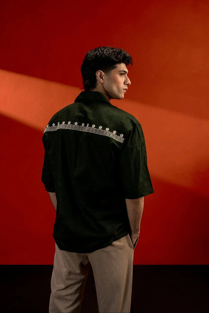 Koti Apparels unisex dark green cotton jacquard shirt with white embroidered detail across the back yoke and quarter sleeves.