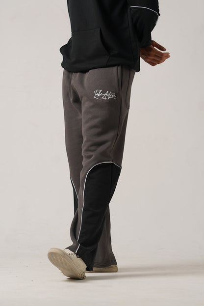 Koti Apparels heavyweight unisex winter fleece trousers in charcoal grey with black side panels and white piping, embroidered logo.