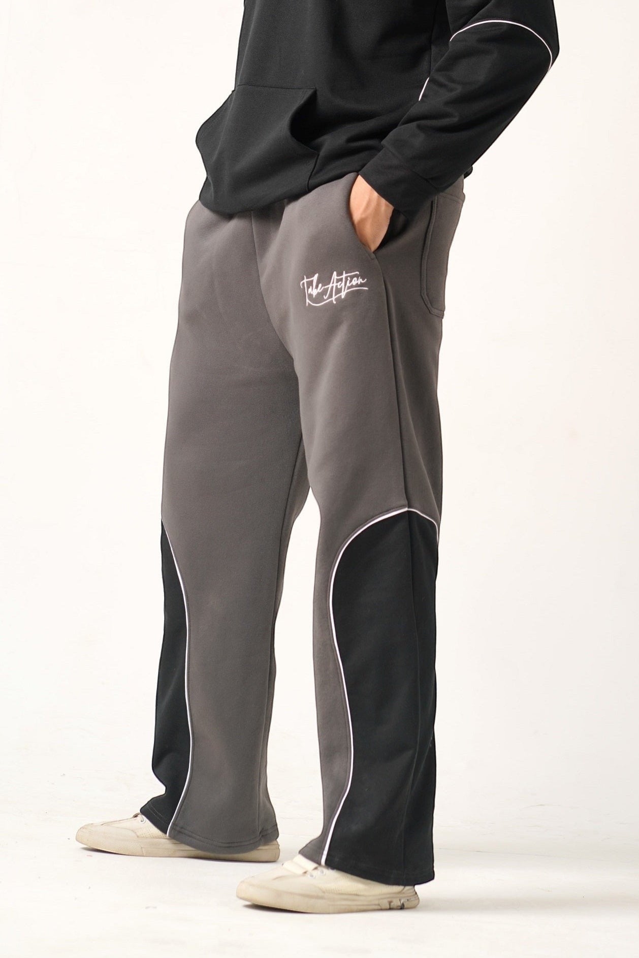 Koti Apparels grey and black heavyweight fleece trousers with white piping and embroidered logo.