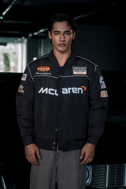 Koti Apparels McLaren F1 jacket in black waterproof parachute fabric with premium embroidered team logos.
