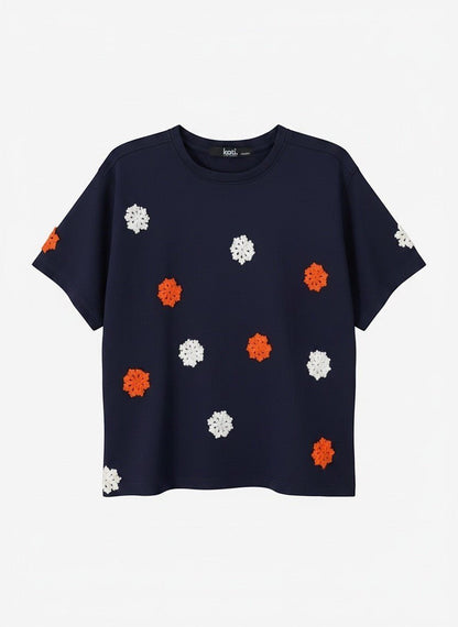 Koti Apparels navy blue short sleeve t-shirt with embroidered orange and white floral appliques.