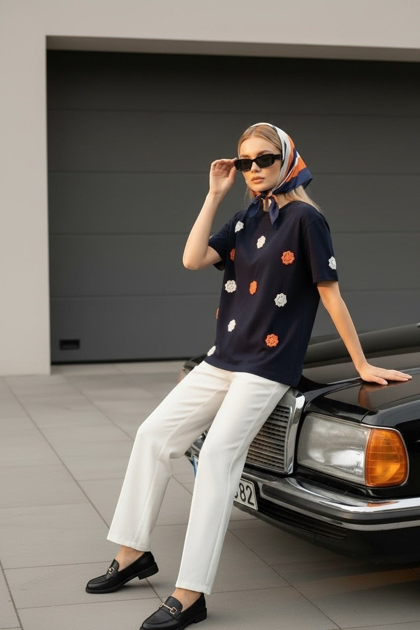 Koti Apparels navy blue t-shirt with embroidered orange and white floral appliques, short sleeves, crew neck.