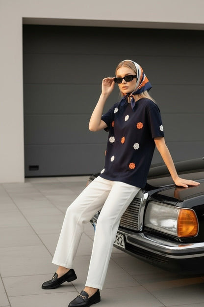 Koti Apparels navy blue t-shirt with embroidered orange and white floral appliques, short sleeves, crew neck.