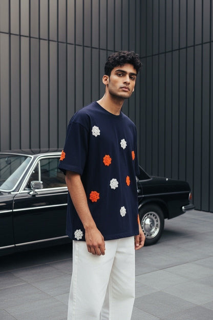 Koti Apparels navy blue t-shirt with embroidered floral appliques in orange and white, short sleeves, crew neck.