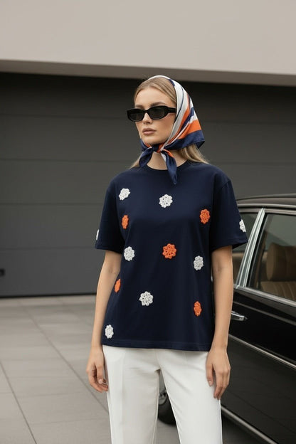 Koti Apparels navy blue short sleeve t-shirt with embroidered floral appliques in orange and white. Classic crew neck.