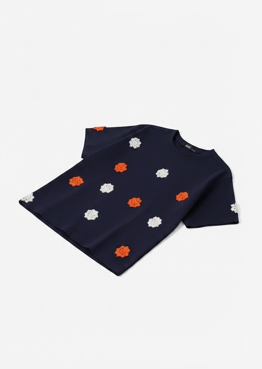 Koti Apparels navy blue short sleeve t-shirt with embroidered orange and white floral appliques, crew neck.