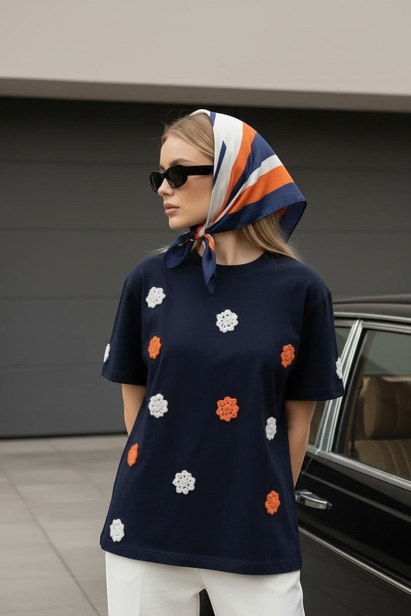 Koti Apparels navy blue short sleeve t-shirt with embroidered floral appliques in orange and white. Classic crew neck.