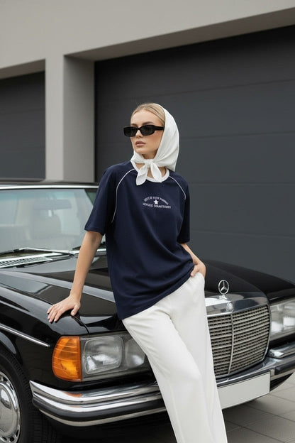 Koti Apparels navy blue cotton graphic t-shirt with white piping on raglan sleeves and relaxed fit.