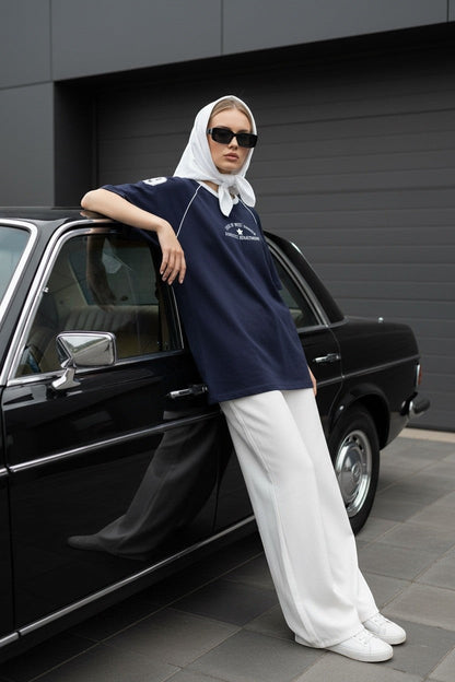 Koti Apparels navy blue cotton graphic t-shirt with white piping on raglan sleeves and retro athletic graphic.