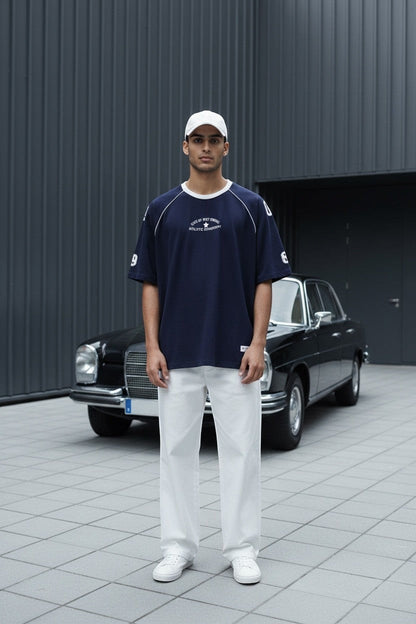 Koti Apparels navy blue cotton graphic t-shirt with white piping on raglan sleeves and oversized fit.