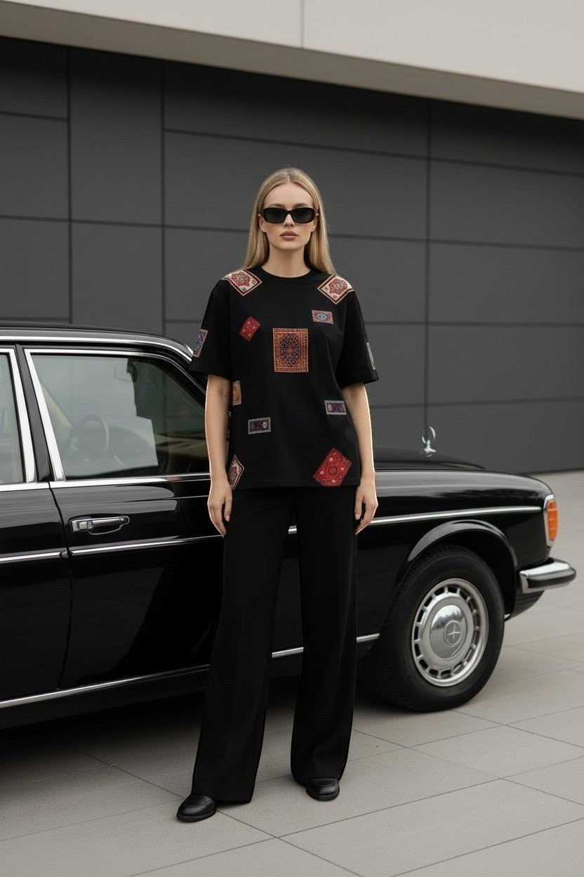 Koti Apparels black cotton t-shirt with patchwork oriental rug graphics. Relaxed fit, crew neck, short sleeves.