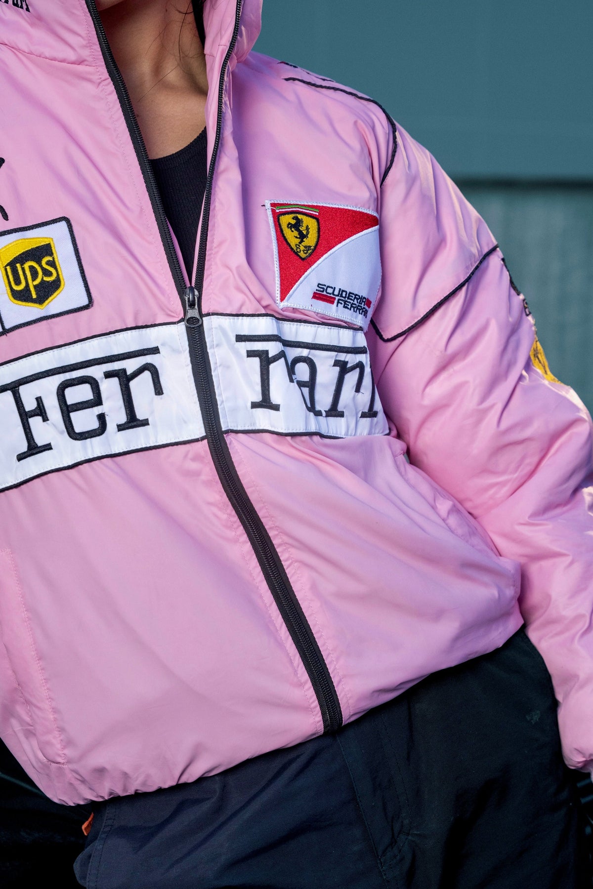 Koti Apparels pink Ferrari racing jacket featuring embroidered Scuderia Ferrari and sponsor logos with a zip front.