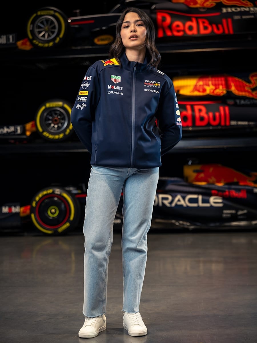 Koti Apparels navy blue polyester Formula 1 racing jacket with Red Bull and partner logos, full zip, and zipped pockets.