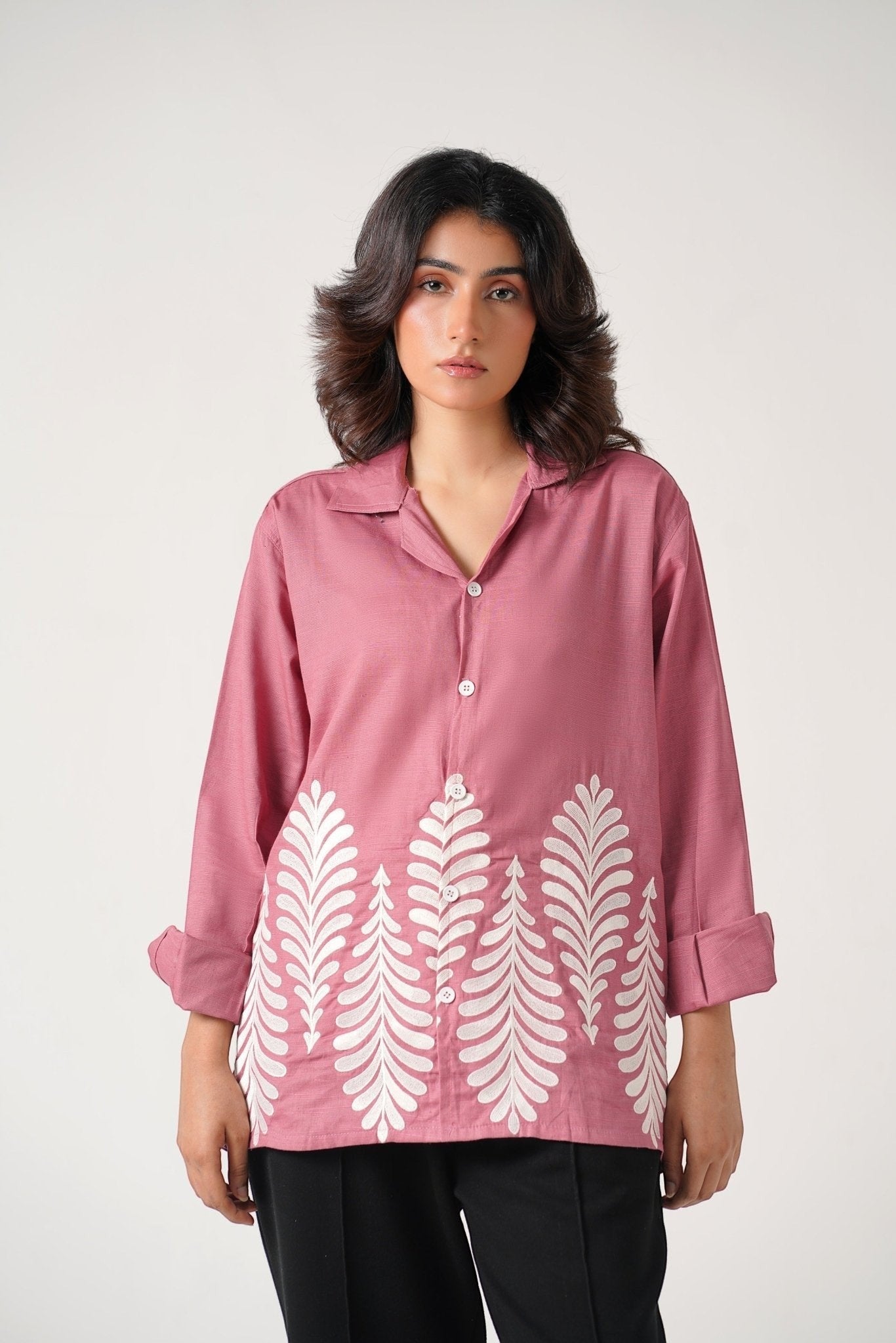 Koti Apparels rose pink unisex shirt with full sleeves and leaf embroidery on the hem. Button-down front, crisp collar.