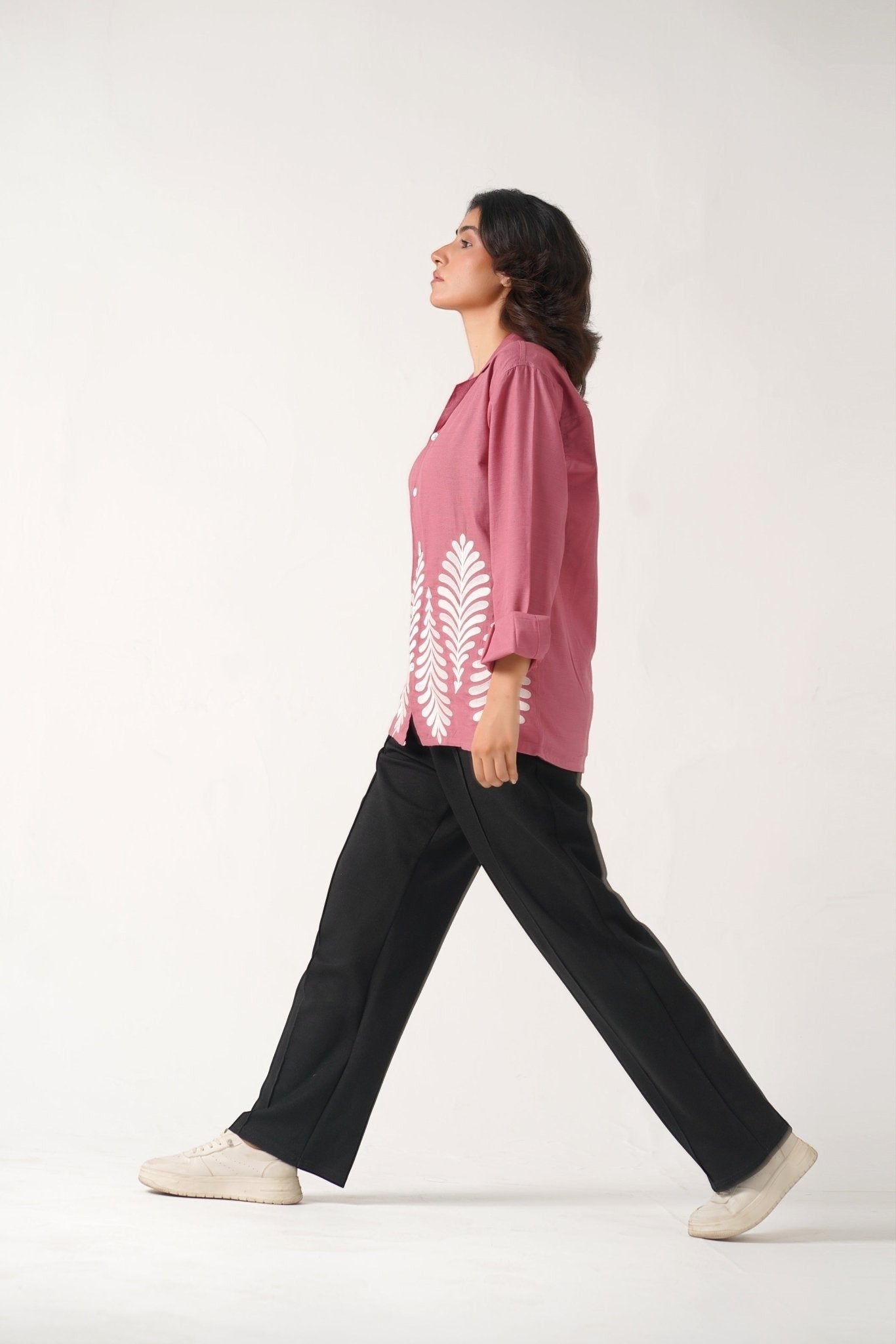 Koti Apparels rose pink unisex shirt with white leaf embroidery, full sleeves, and button-down front. Model wears size S.
