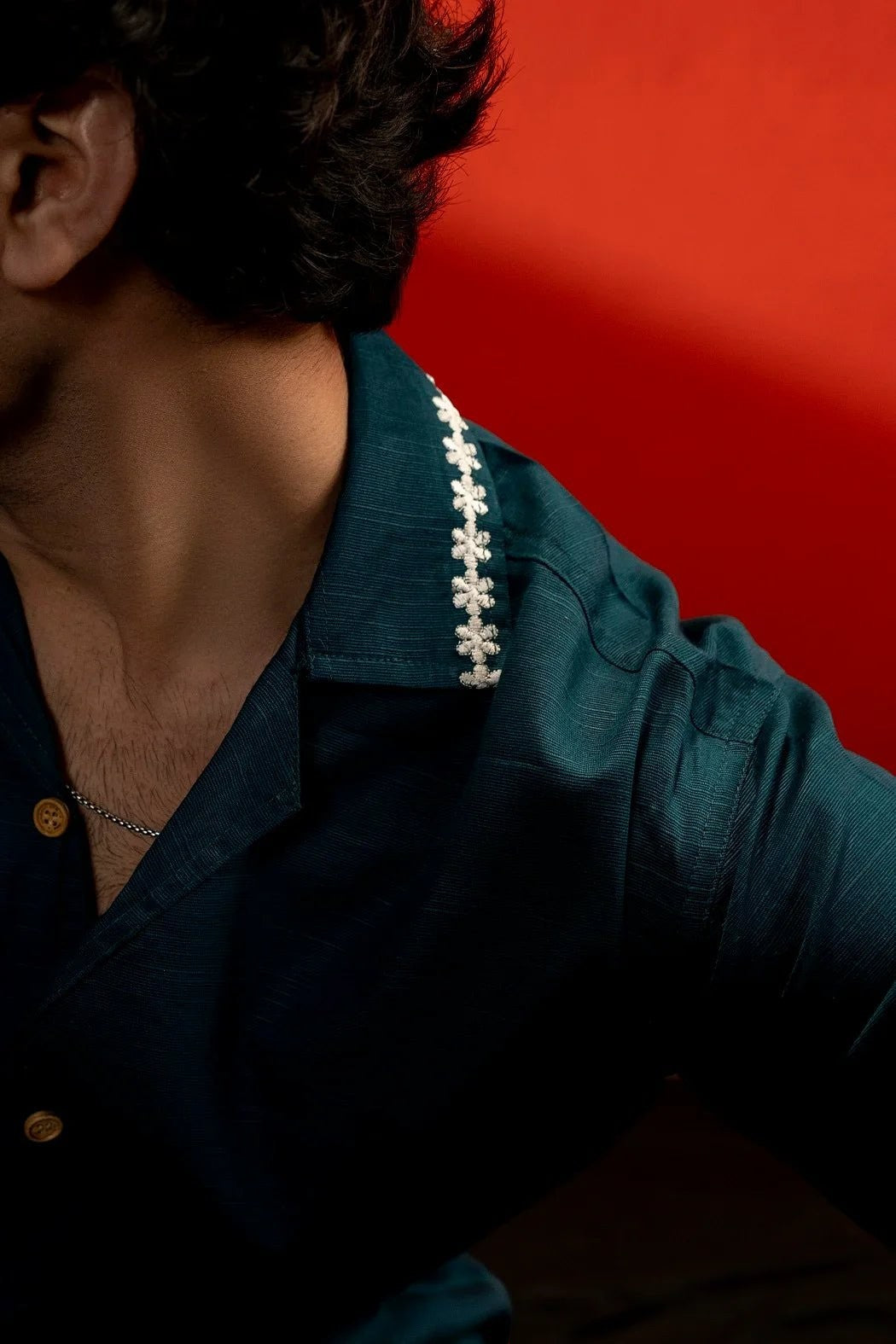 Koti Apparels sea green cotton shirt with white floral embroidery on the collar and quarter sleeves. Relaxed fit, unisex design.